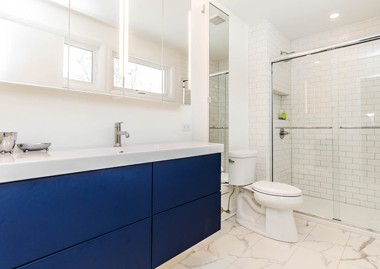 bathroom granite floor tile blue vanity doors mirror wall cabinets and glass shower