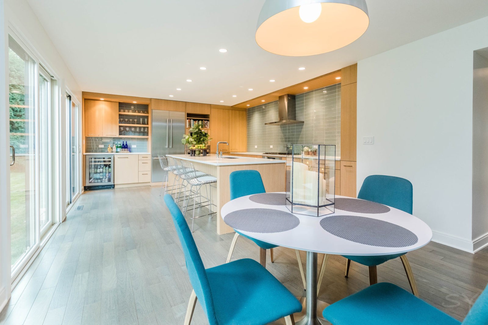 livco bright open kitchen renovation light grey hardwood flooring recess lighting over island