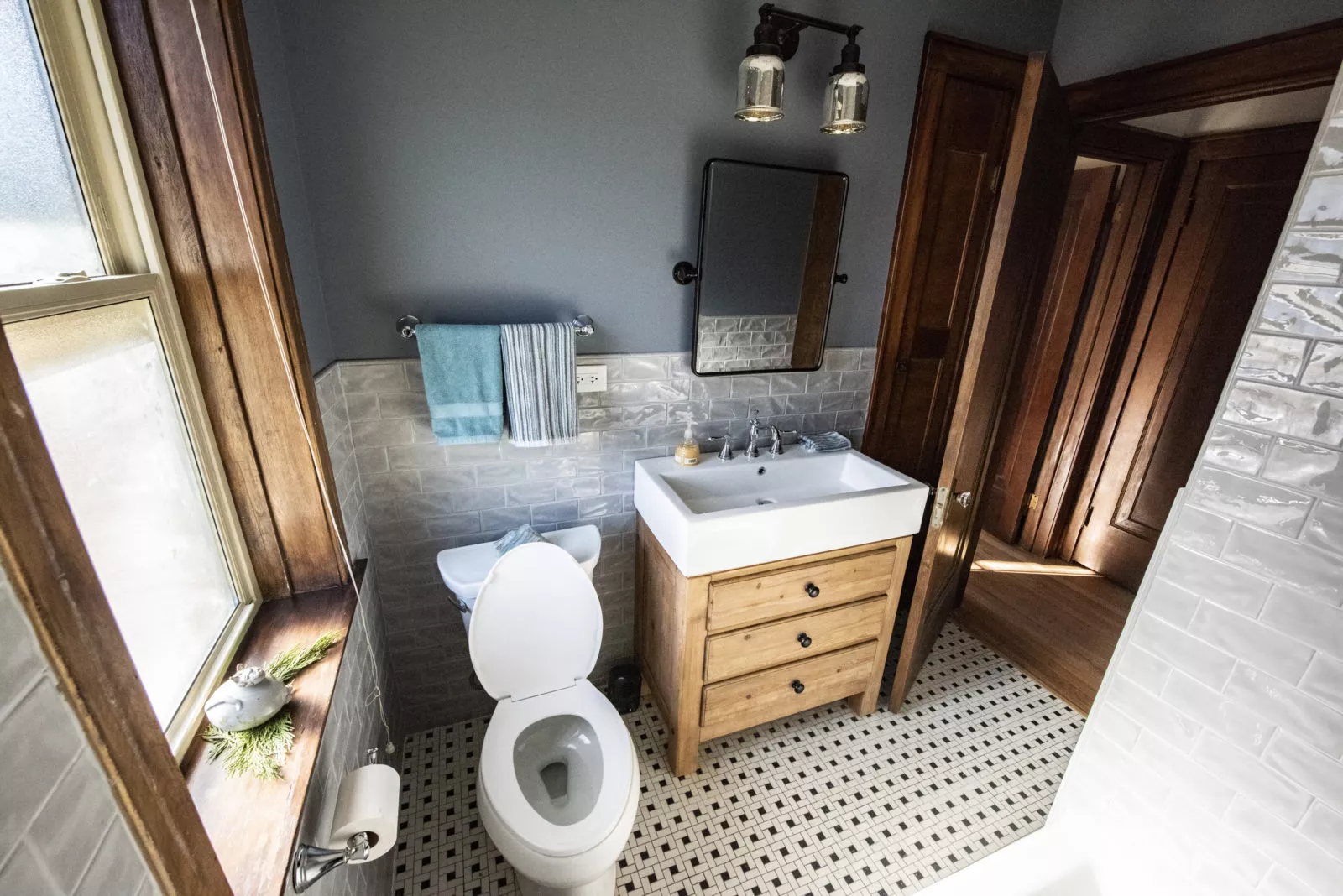 livco vintage bathroom remodel tile flooring deep oak doors white vessel sink over light wood vanity