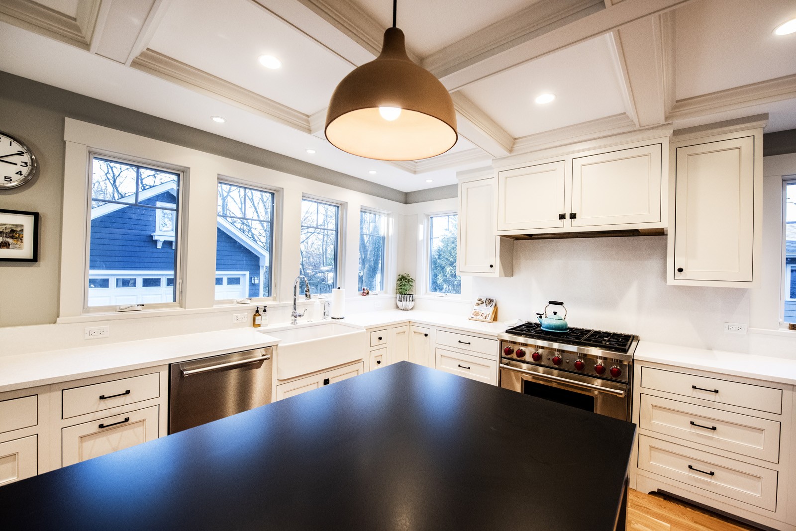 livco kitchen remodeling white cabinets patterned ceiling large light fixture over dark island