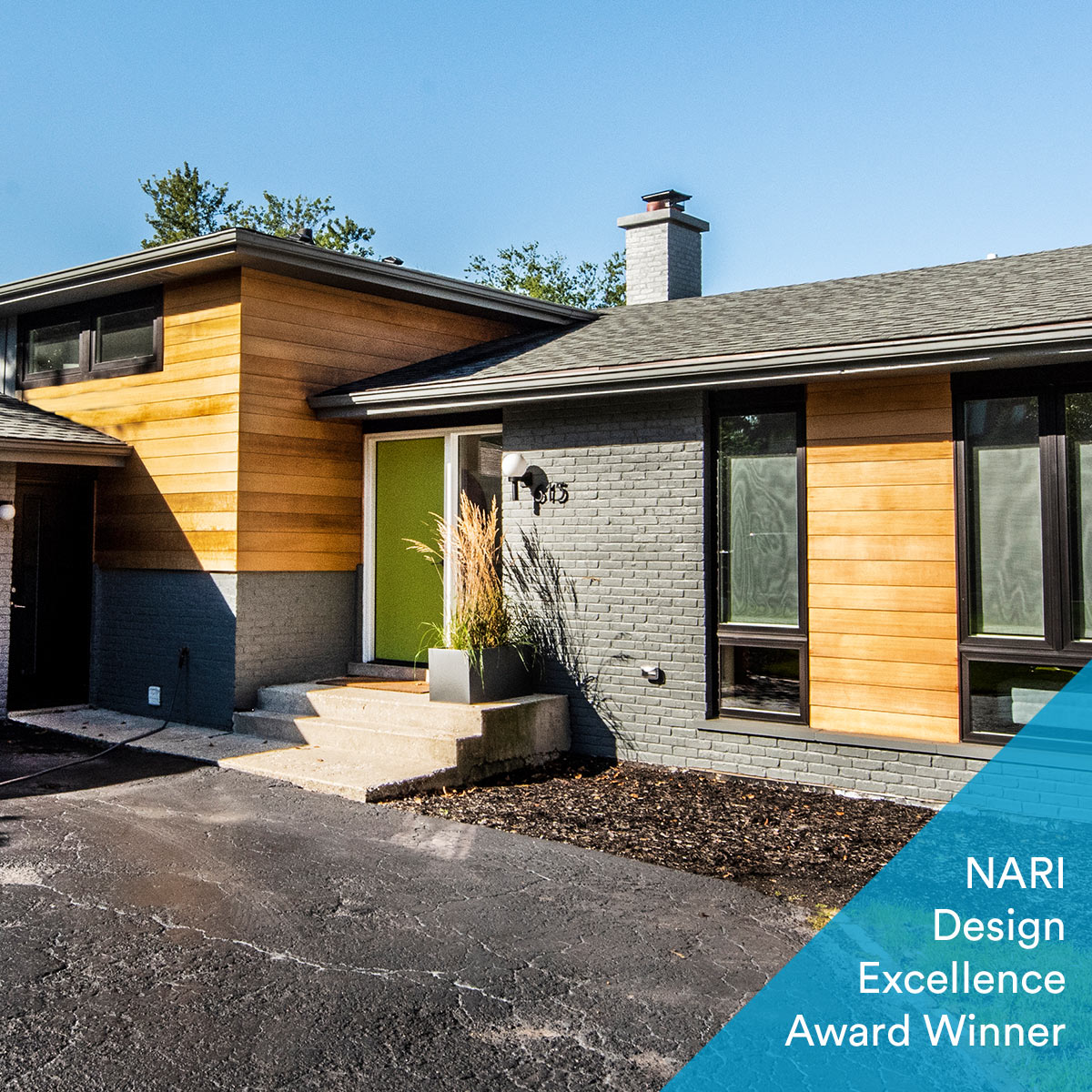 mid century split level exterior renovation with new clear cedar siding and a modern aesthetic with award winning badge
