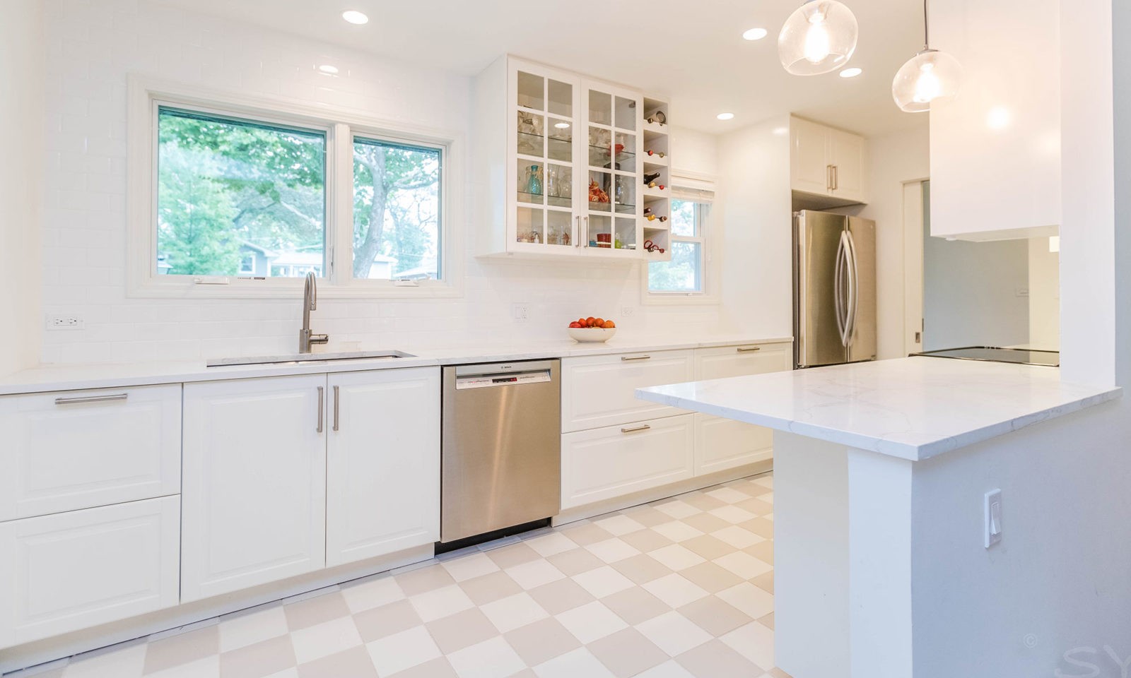 mid century modern ranch renovation and remodel view of white kitchen and sink under window