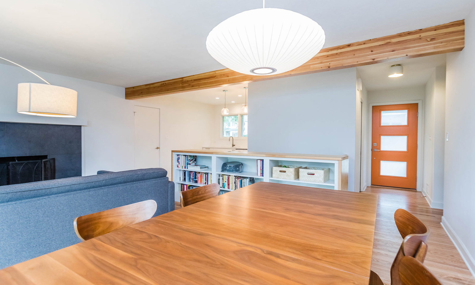 mid century modern ranch renovation and remodel view from dining room with kitchen and family room beyond