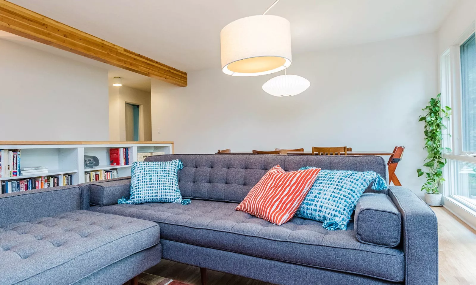 mid century modern ranch renovation and remodel view of family room with dining room beyond