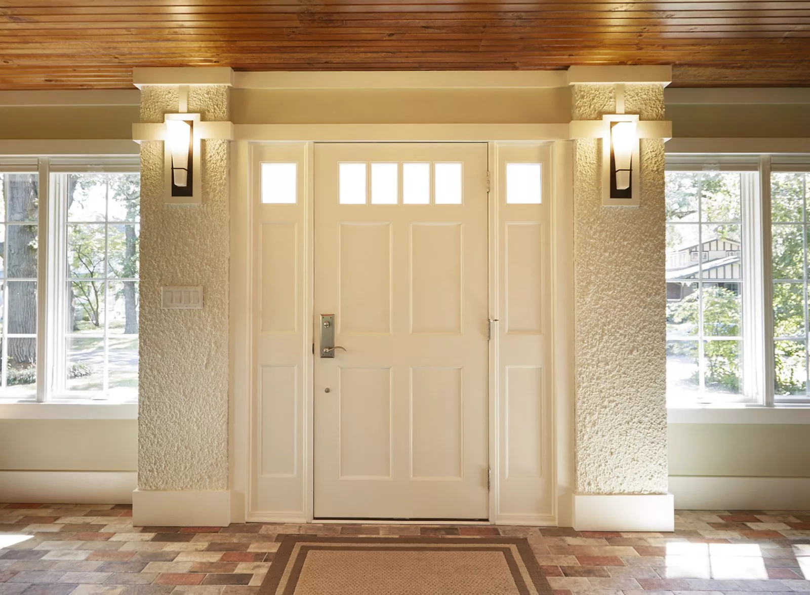 livco foyer remodel white painted door with chrome handle white stucco white molding