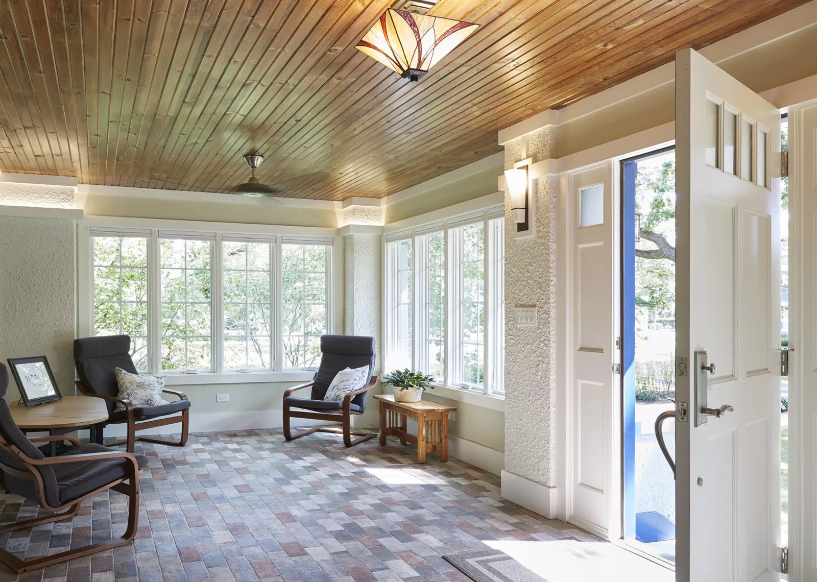 LivCo entryway remodel large open foyer wooden ceiling bright seating area