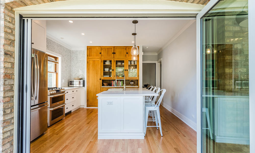 kitchen remodel with folding galss doors to the deck open with accordion screen