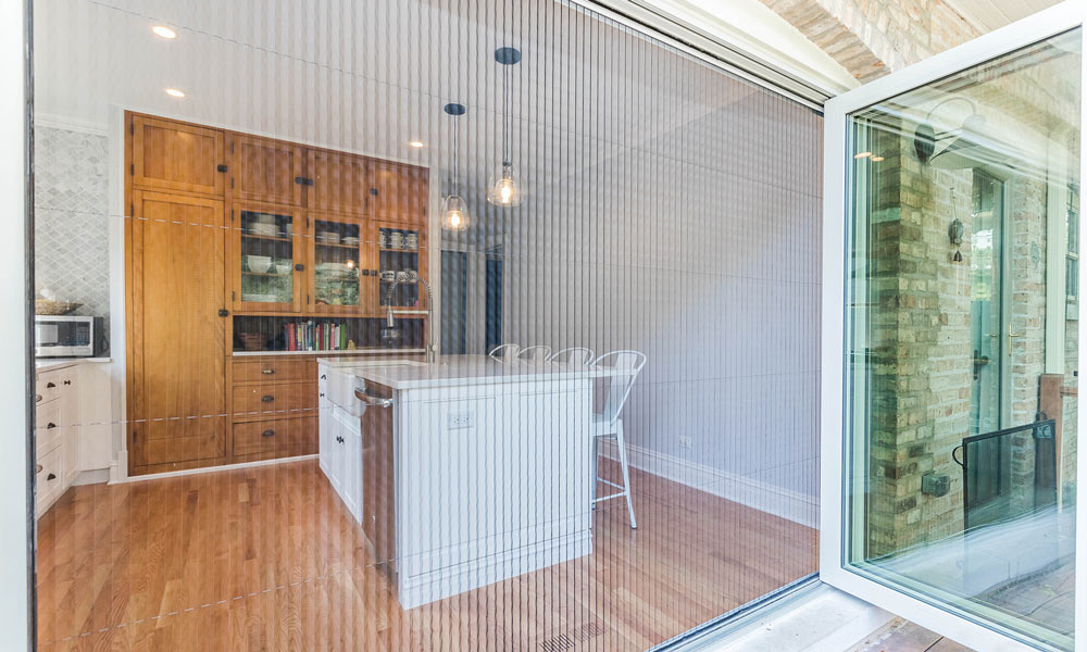 kitchen remodel with folding galss doors to the deck open with accordion screen