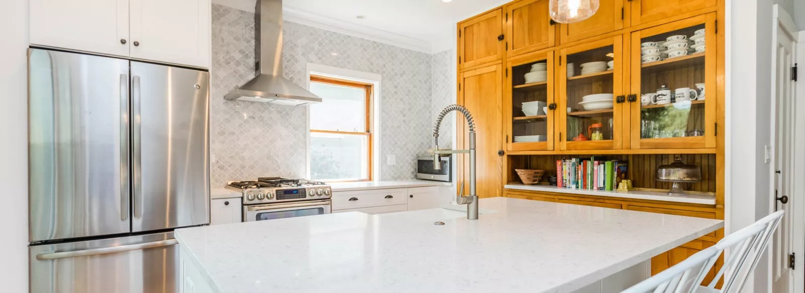 bright kitchen with granite counter tops stainless steel appliances light wood wall cabinets