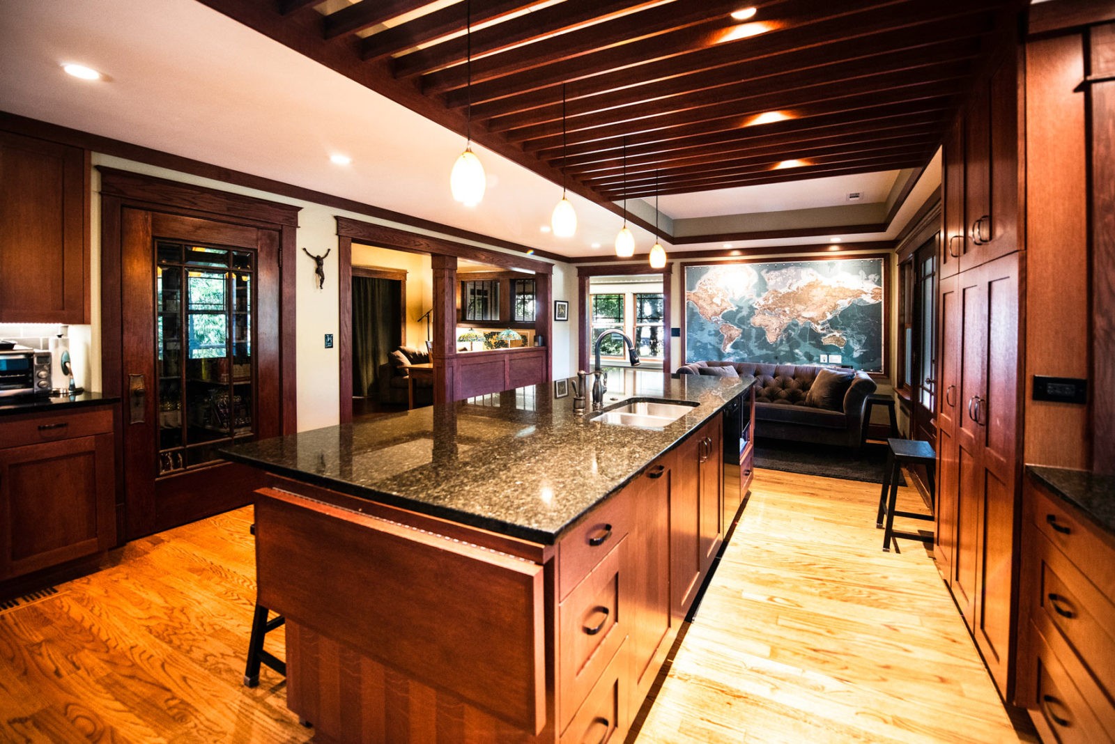 livco kitchen renovation exposed beams large quartz island black and brown color scheme