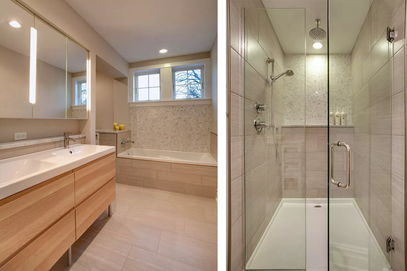 Bathroom with built-in bathtub, two sinks with mirrors, shower with glass door and grey tile walls