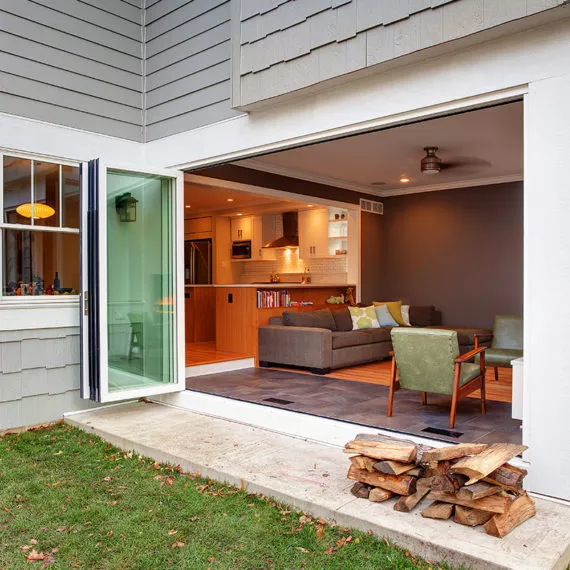 Sliding door wall open to reveal a newly renovated living room