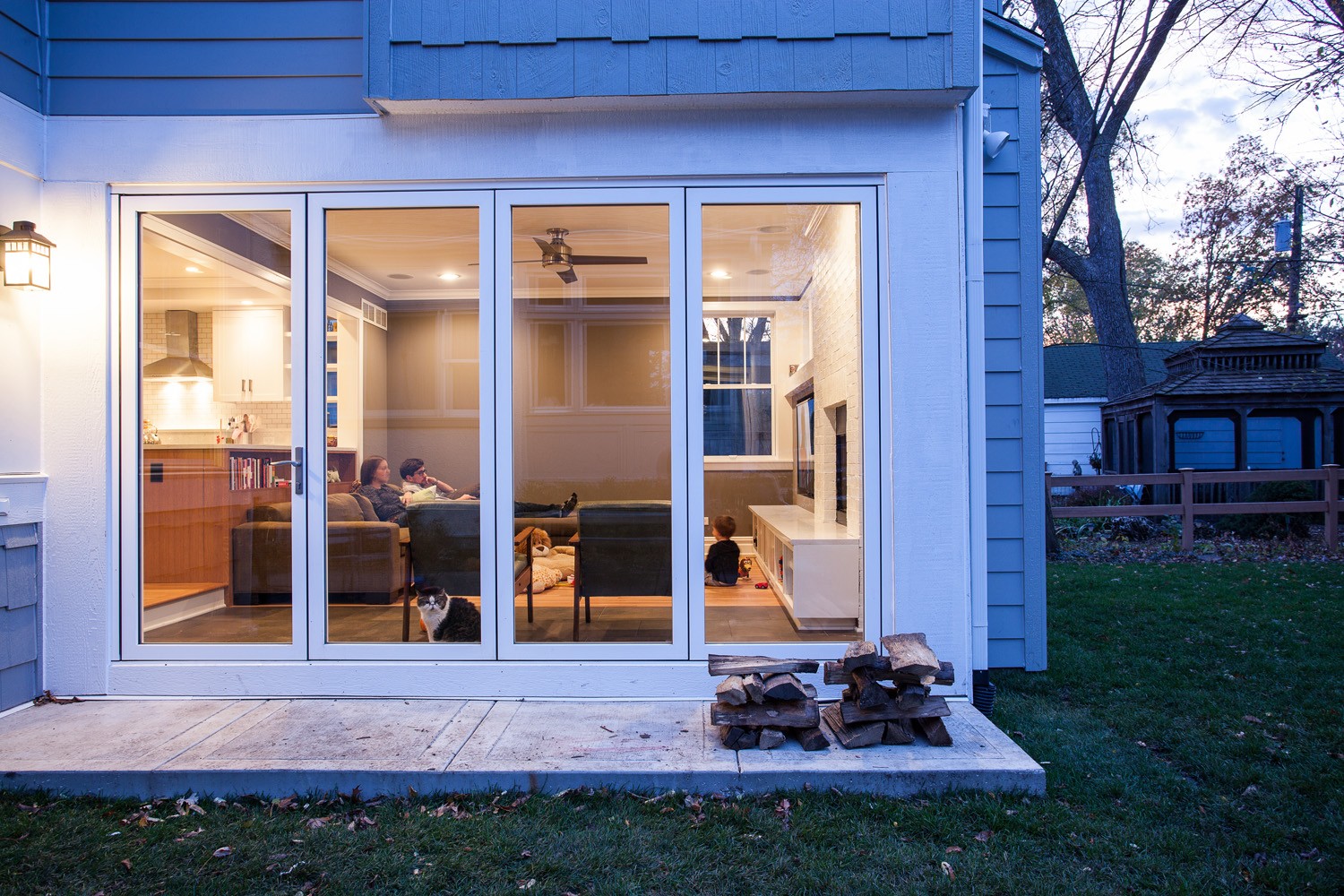 Home living room addition with glass sliding doors