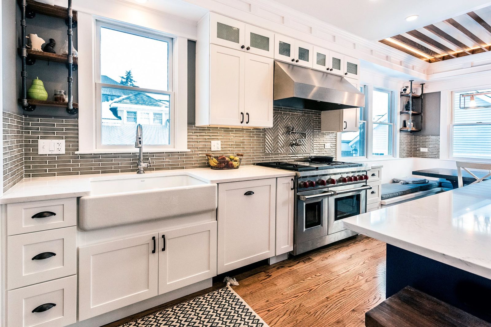 LivCo kitchen remodel white cabinets undermount sink hardwood floors white island