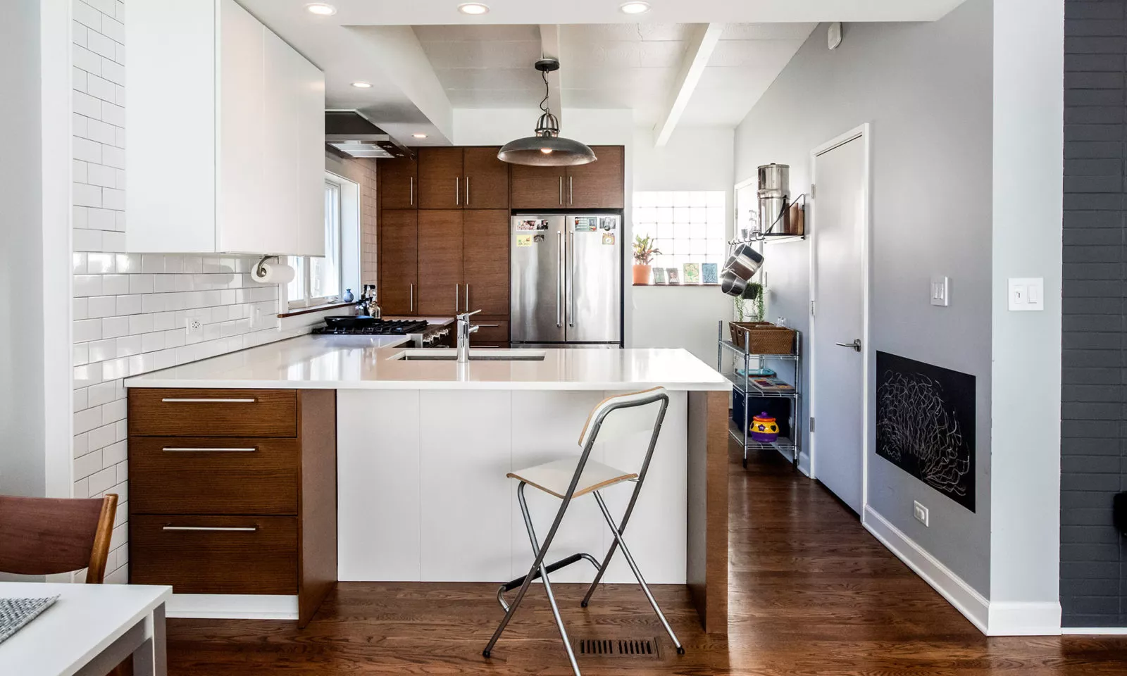 la grange kitchen with dark rift oak cabinets and white panels