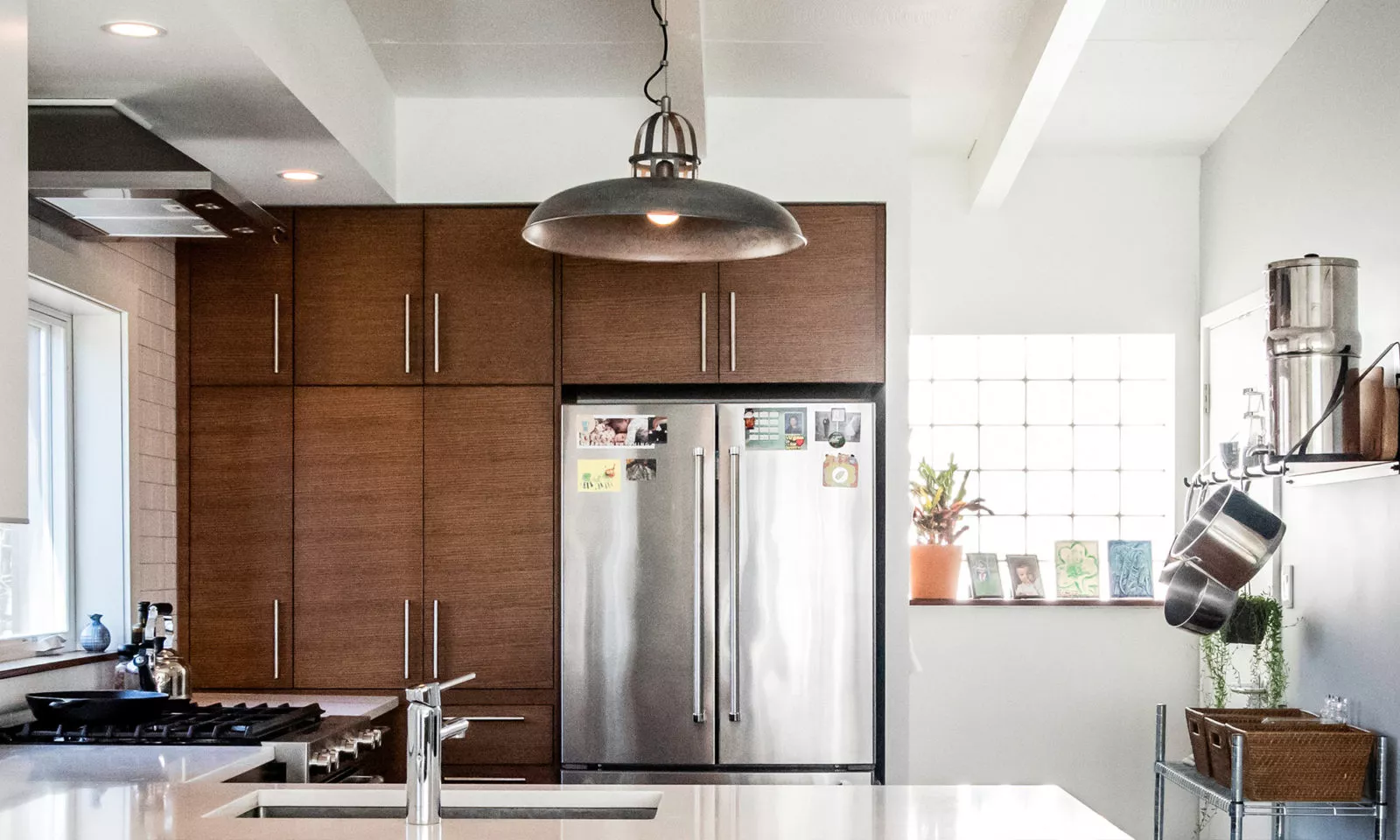 livco small bathroom renovation bright brown cabinetry stainless steel fridge white countertops