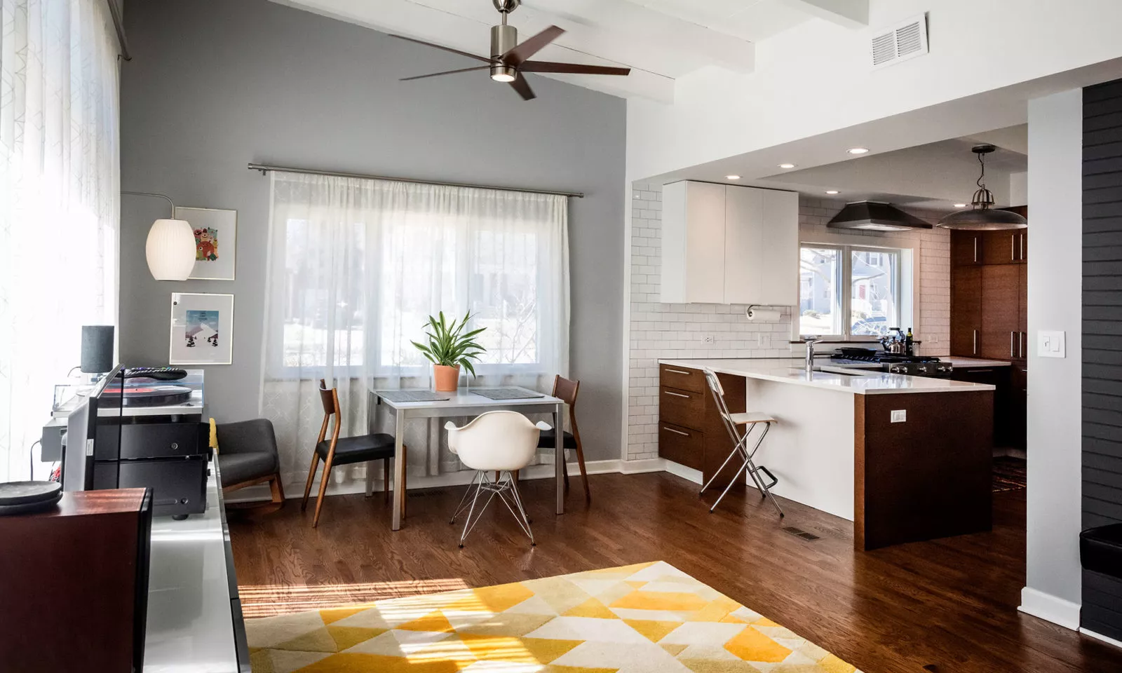 la grange kitchen with dark rift oak cabinets view from nthe fmaily room with desk area