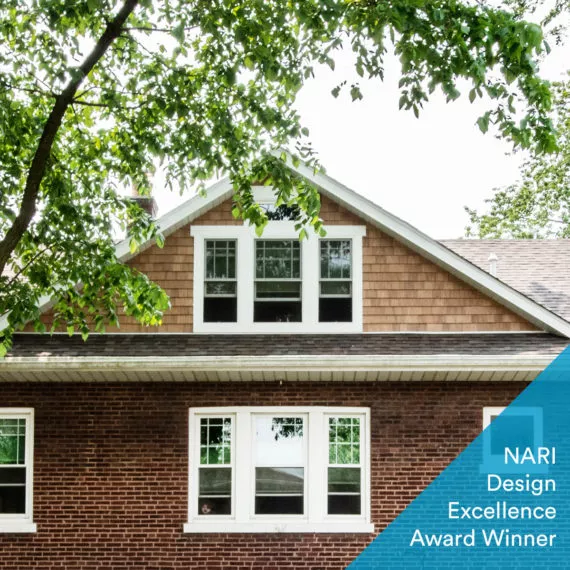 photo of brick home with dormer and awrd designation