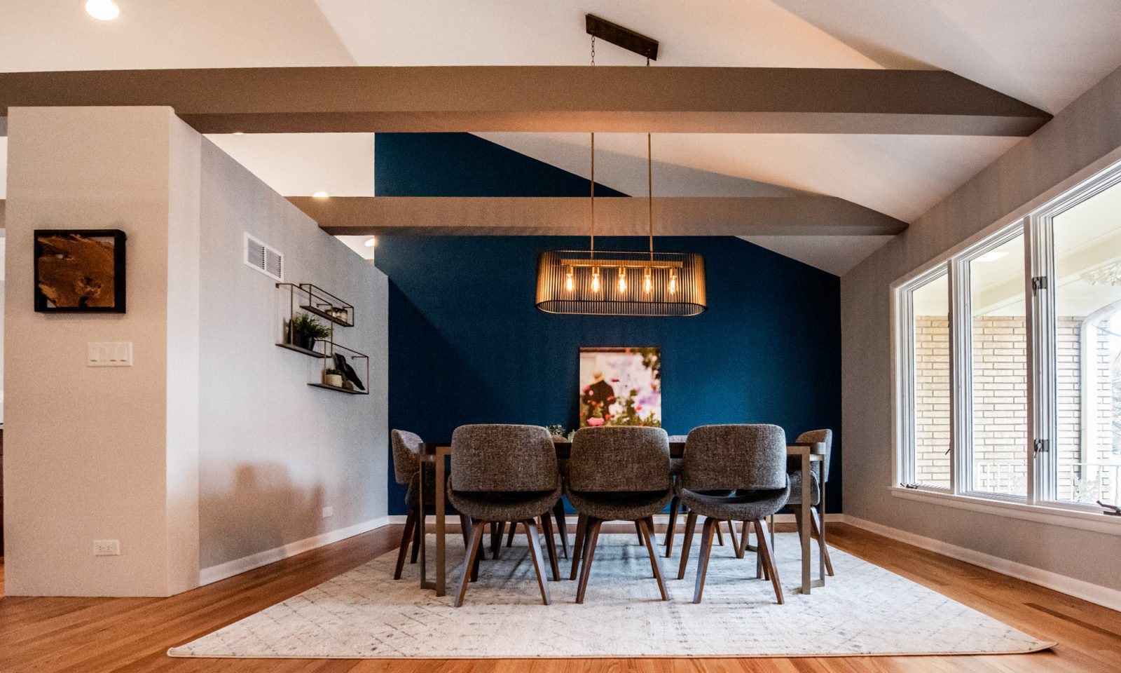 LivCo dining room design remodel grey exposed beams blue feature wall modern light fixture