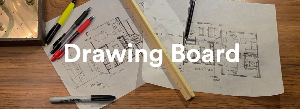 The words Drawing Board in white text overlay architect drafts sheets with a ruler and pens on them