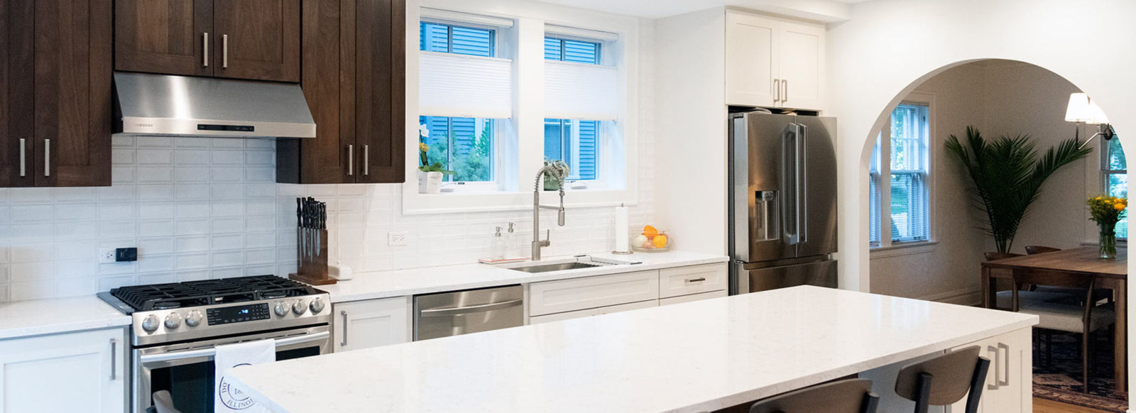 view of a recently remodeled kitchen with white and walnut cabinets