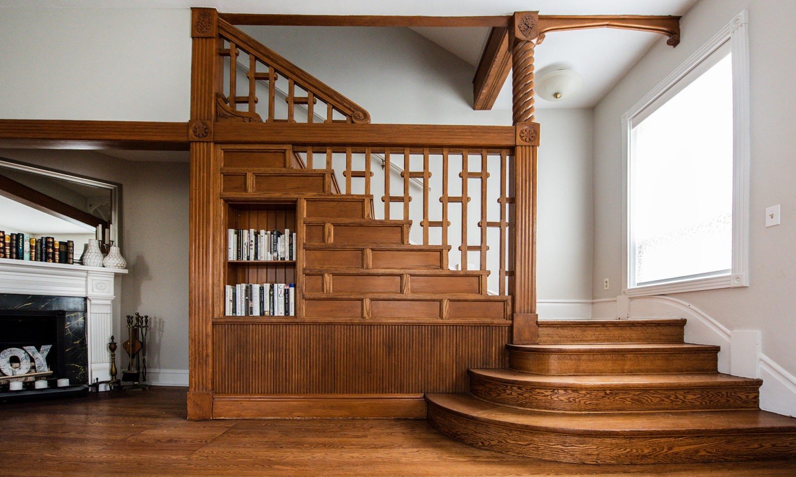 Newly renovated wooden stairway with grand entrance steps