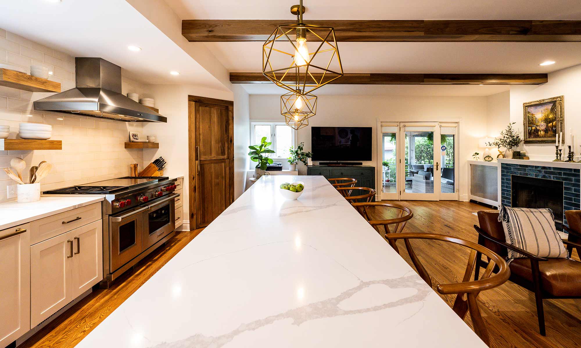 large quartz countertop island in a luxury kitchen renovation