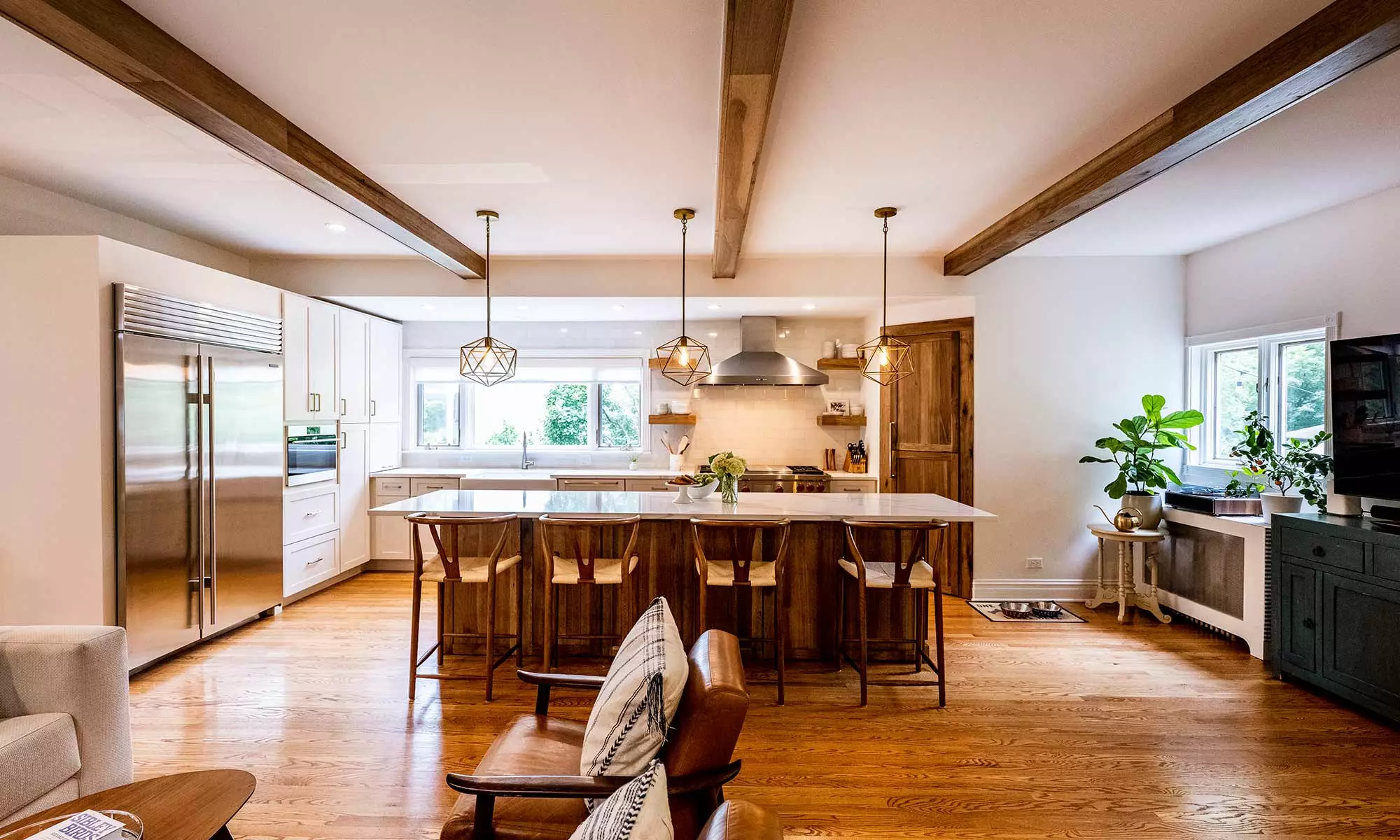 bright kitchen remodel exposed ceiling beams white cabniets stainless steel appliances large island