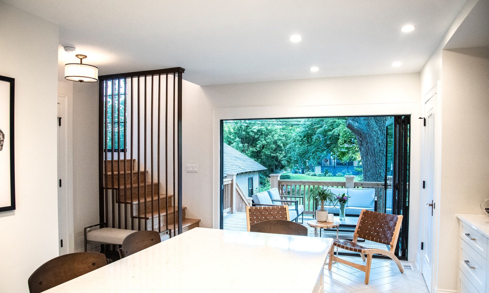 Renovated kitchen with glass doors opening to outdoor patio space