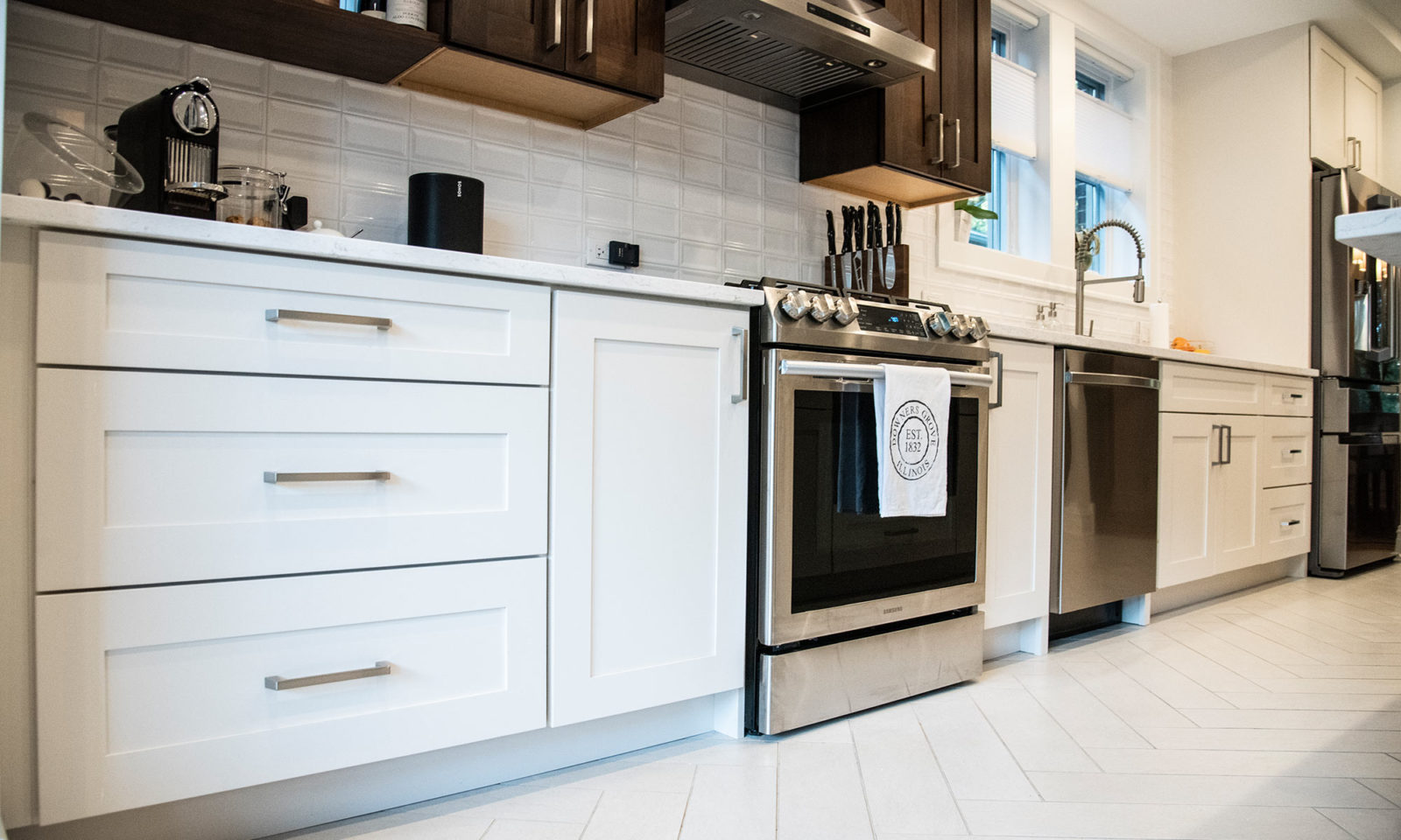 livcompanies kitchen renovation white cabinets white herringbone tile flooring