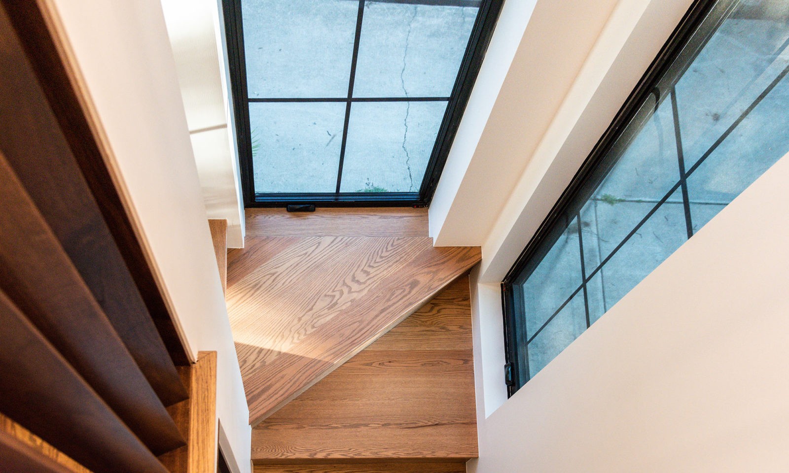 View of a stairwell landing and windows from above