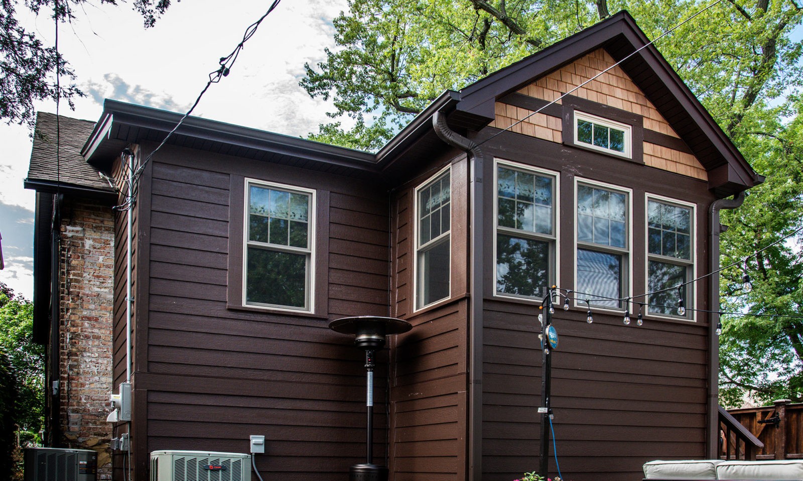 Dark wood exterior on a uniquely shaped home