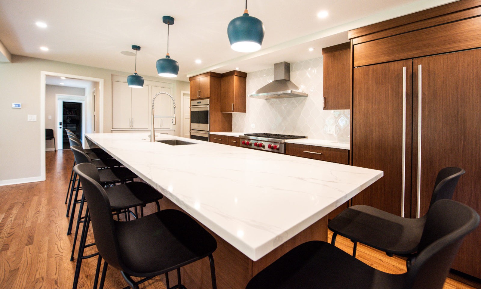 modern hinsdale kitchen remodel with white counters and blue pendant lights