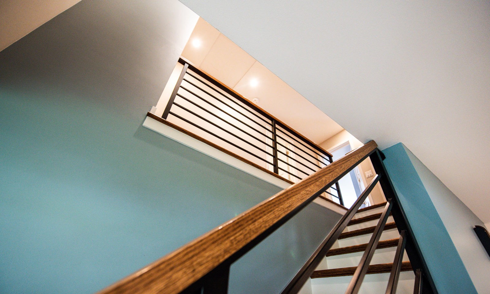 modern stair with black metal railings in hinsdale