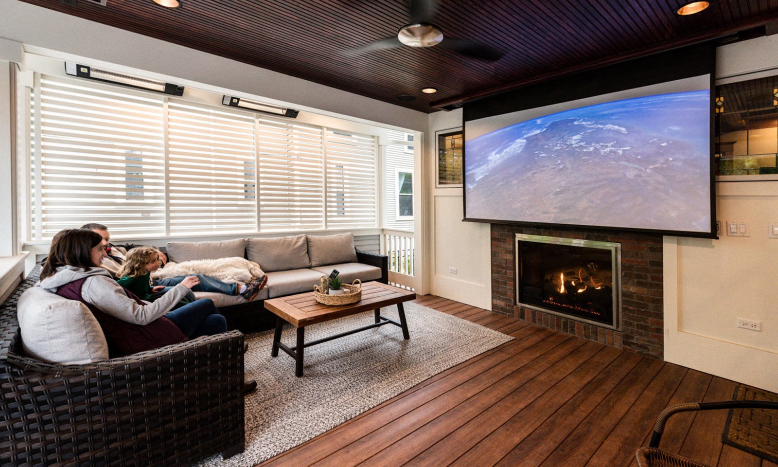 view of movie screen on exterior porch addition