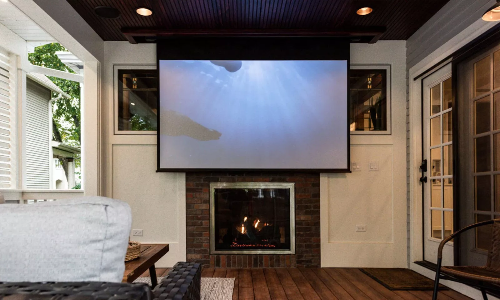 view of movie screen on exterior porch addition