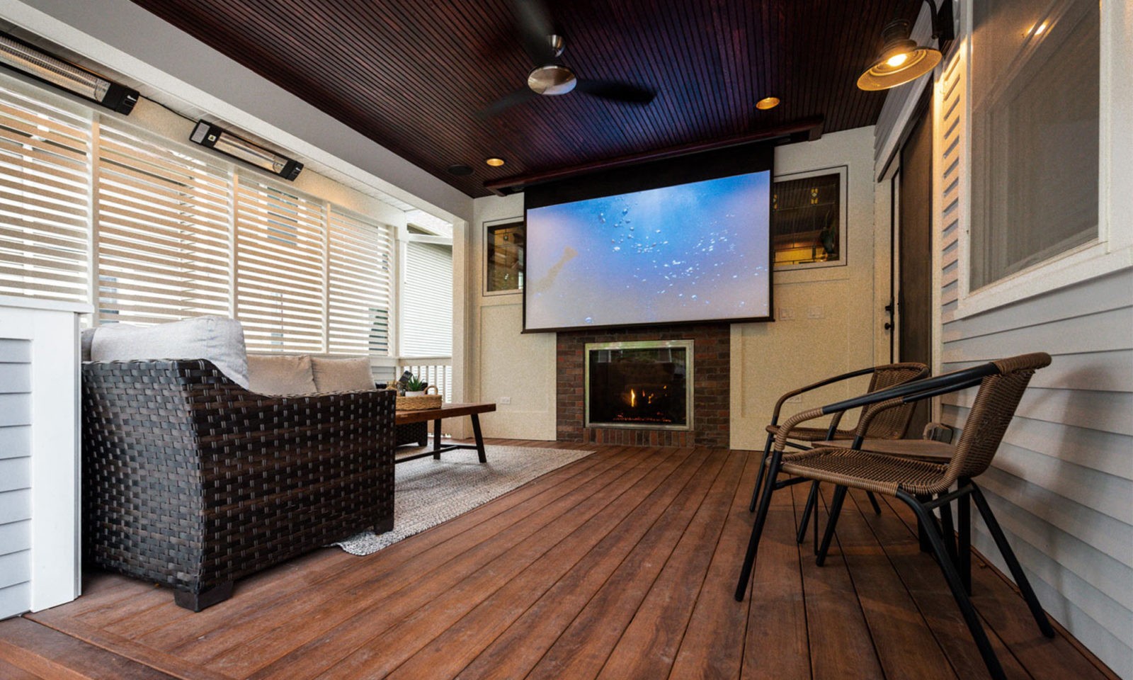 view of movie screen on exterior porch addition