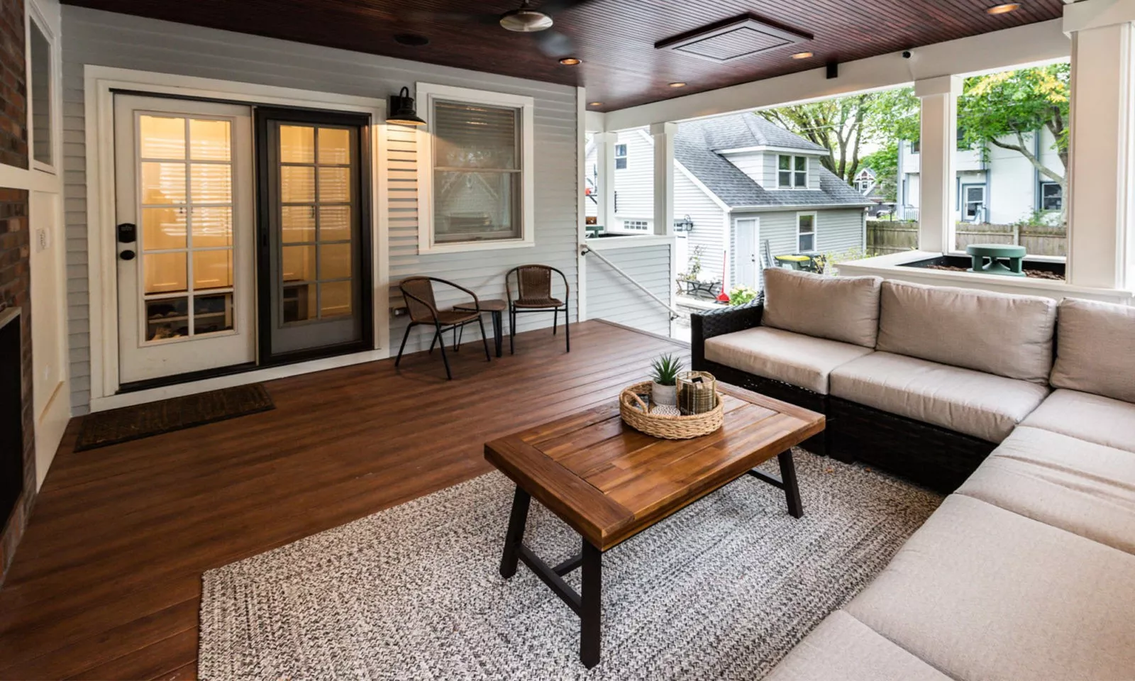 view of family on couch onn outdoor living room