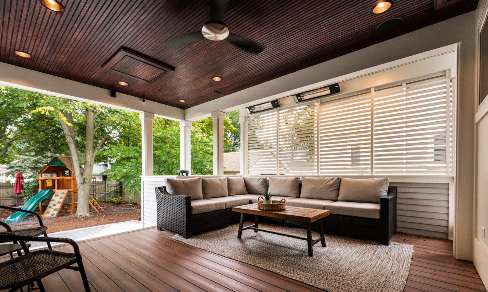 view of couch on exterior porch addition