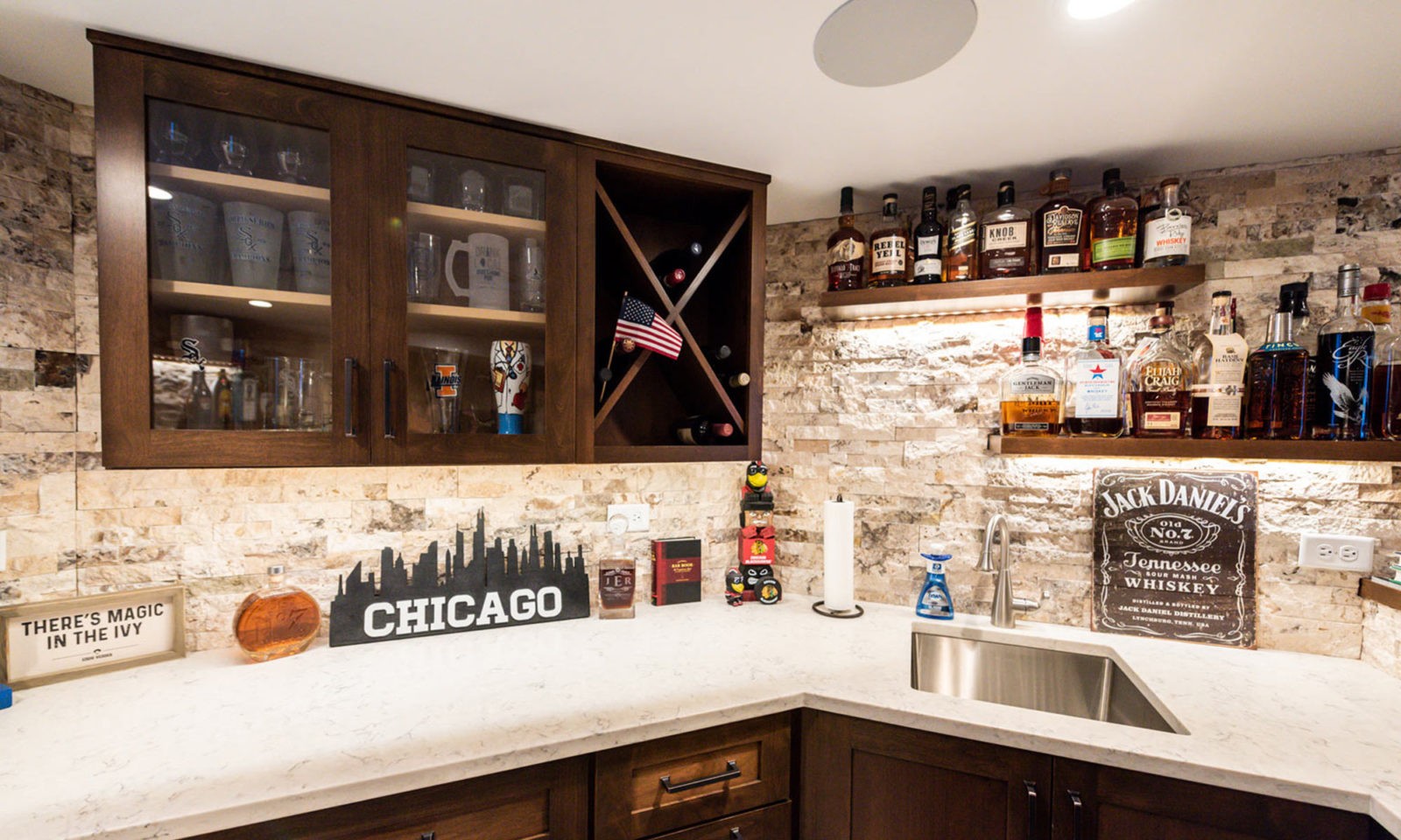 view of basement remodel bar with sports game on TV