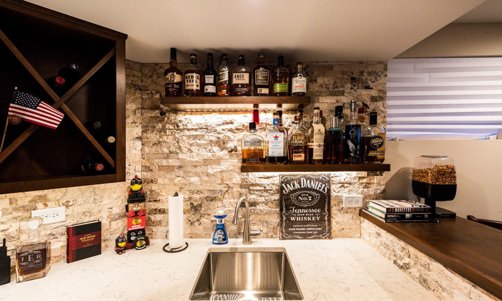 view of basement remodel bar with sports game on TV