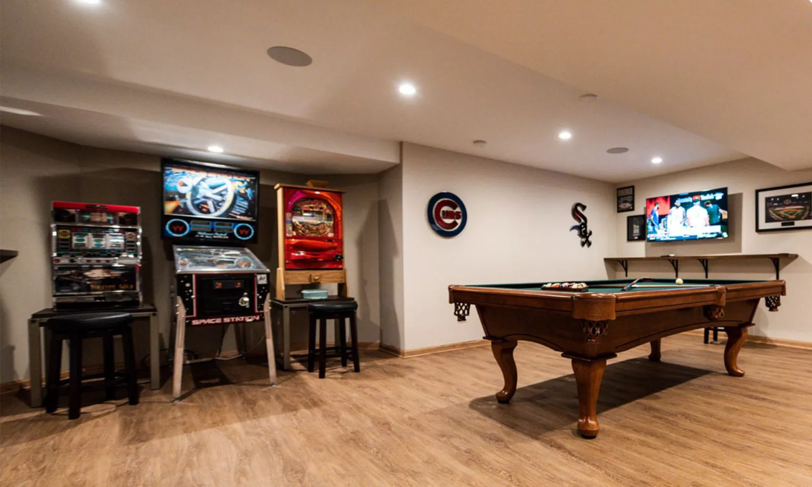 view of pinball and arcade game area in basement remodel