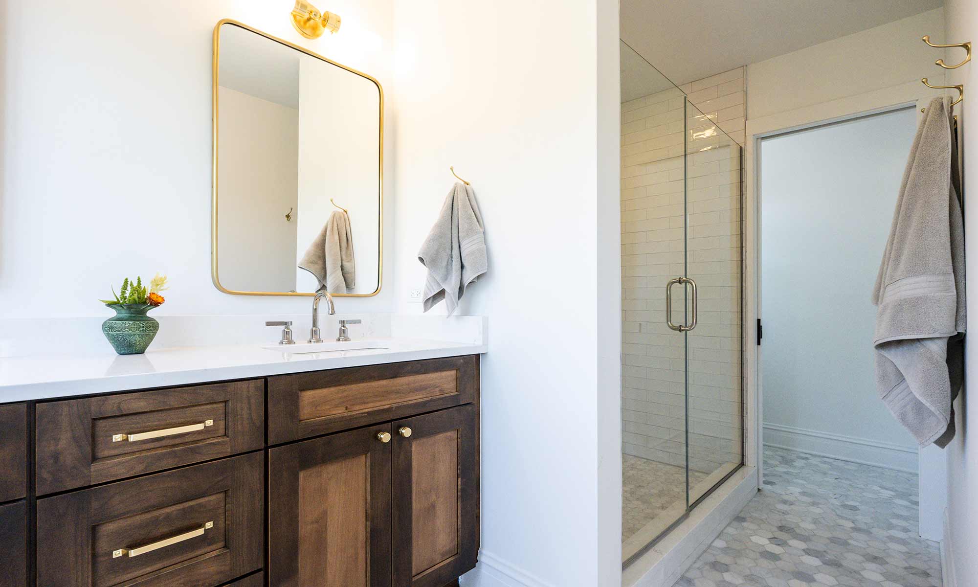 luxury bathroom remodel with walnut vanity