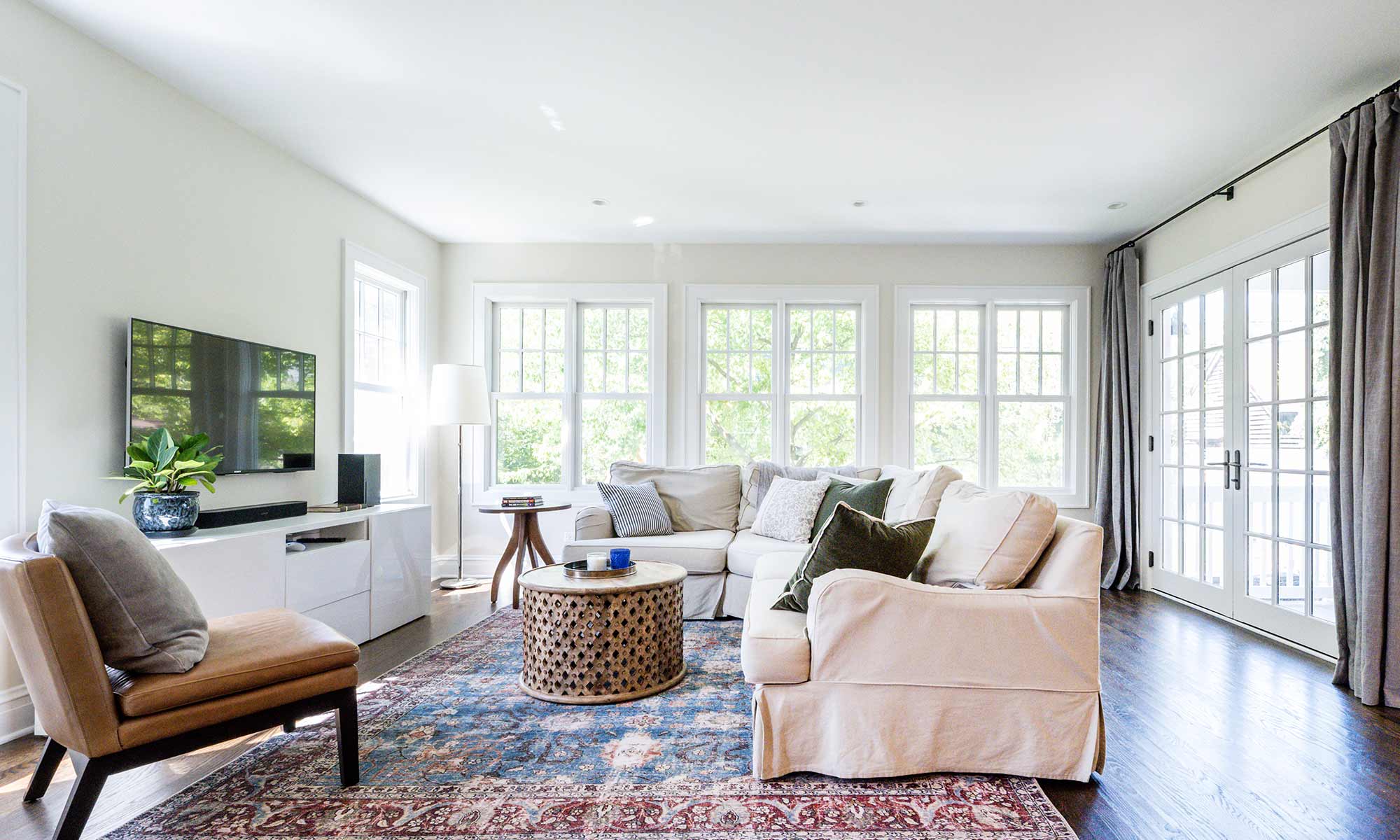 view of family room addition with windows across the back wall