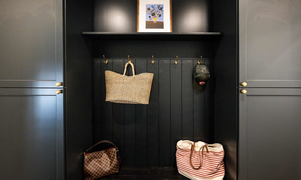 view of luxury remodel mudroom and hallway with dark grey cabinets