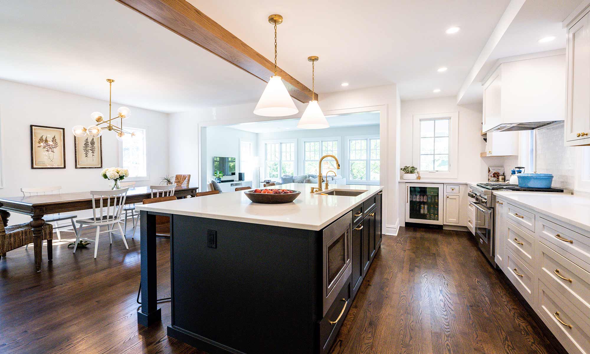 liv companies kitchen renovation white cabinetry contrast dark island exposed beam