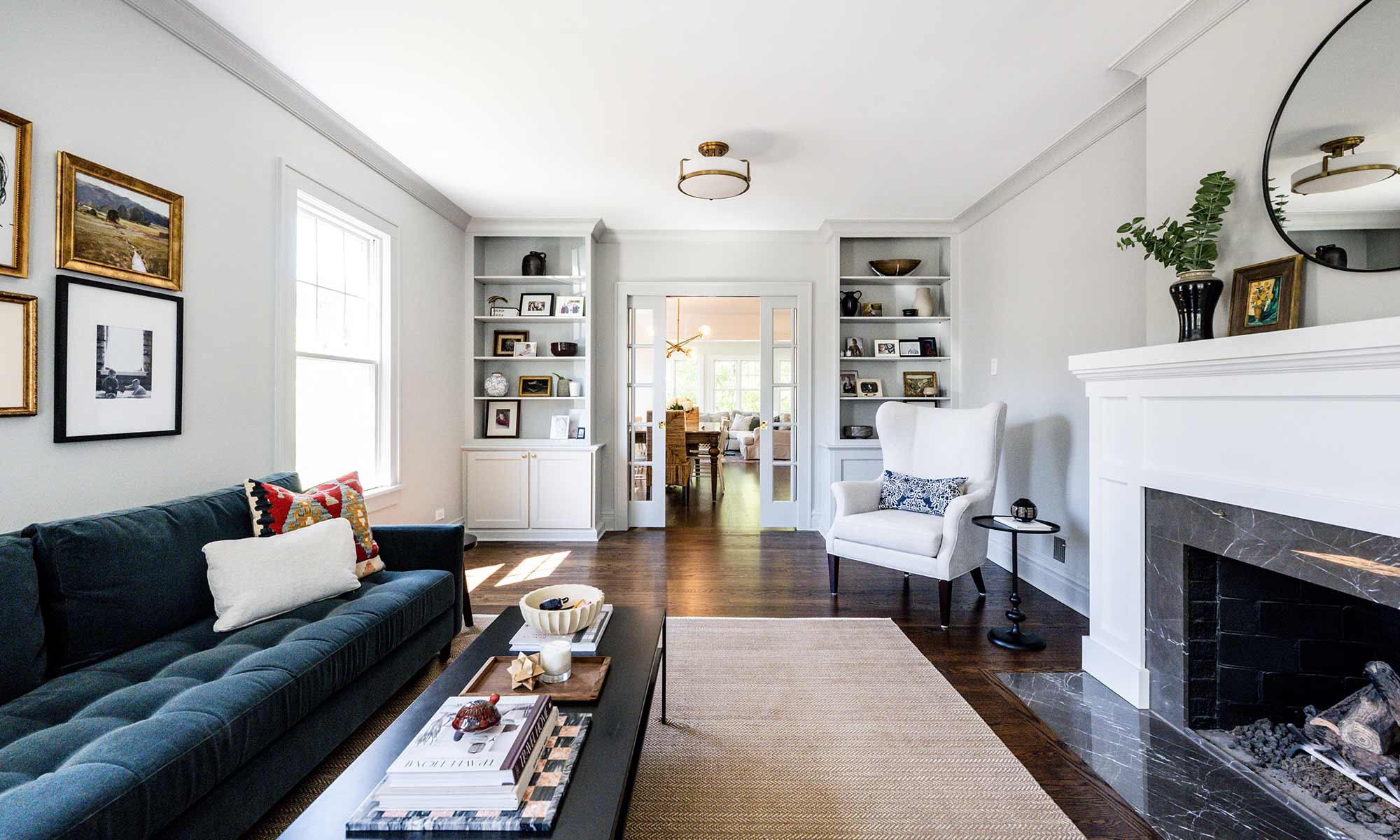 view of living room remodel with built-in shelving