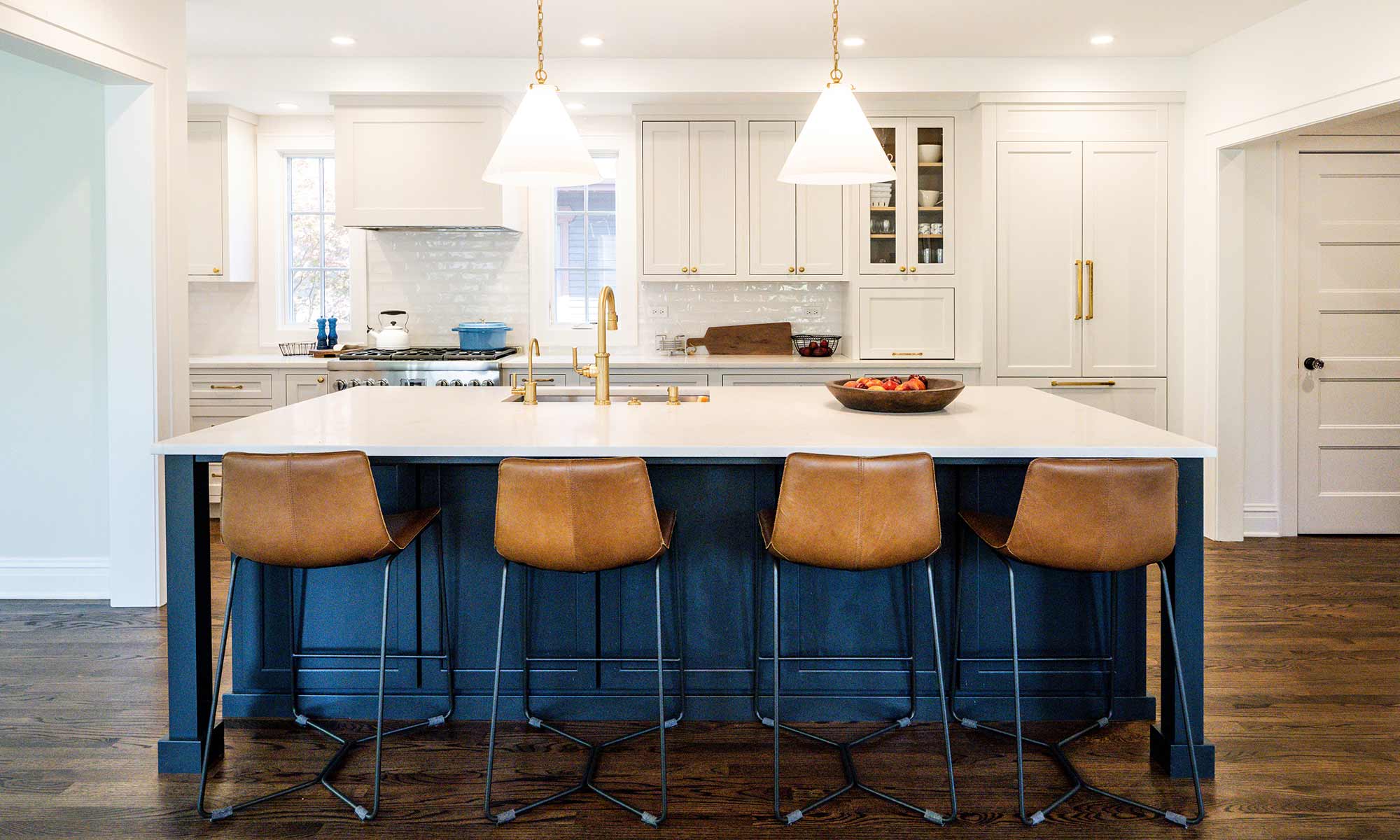 livcompanies kitchen renovation with large black island white countertop 4 barstools