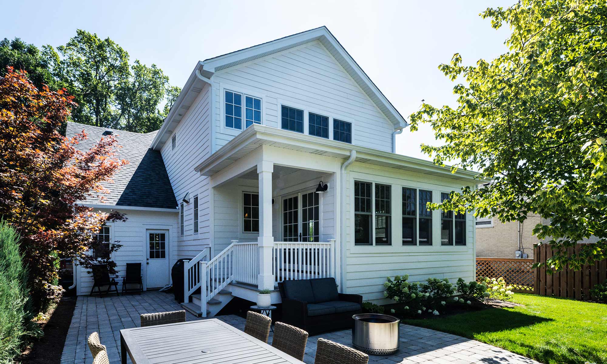 exterior photo of white home with open front porch in Chicago's western suburbs