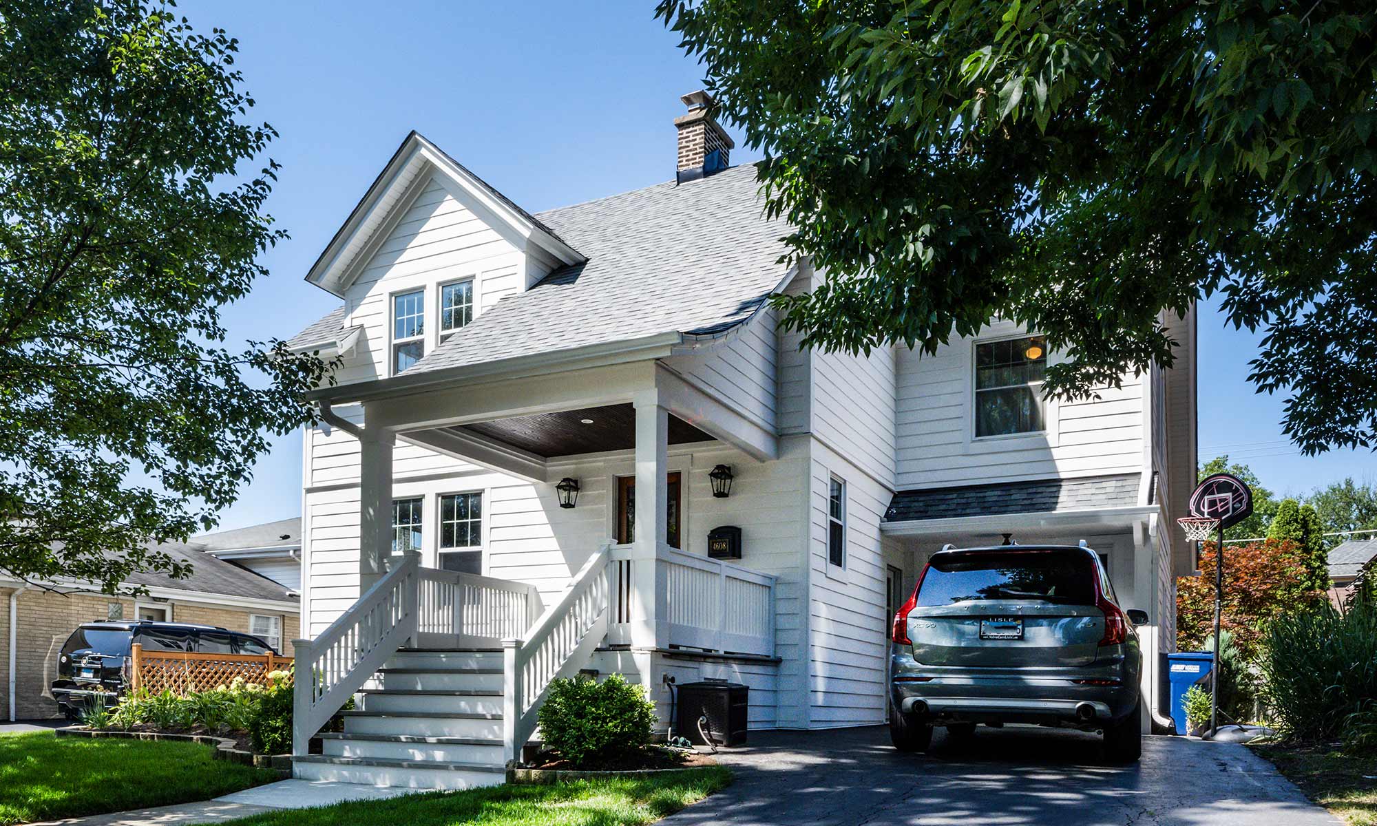 exterior photo of white home with open front porch in Chicago's western suburbs